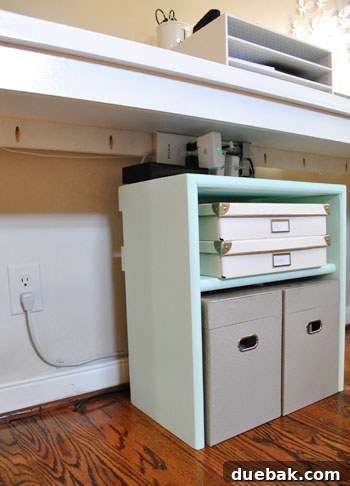 Untangle Your Tech Cables 19 Organized desk area with storage shelf back in place