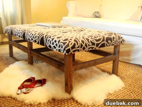 Handcraft Your Perfect Ottoman 2 Completed tufted ottoman in a stylish living room setting