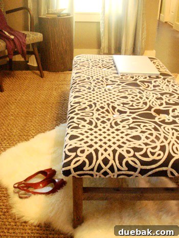 Handcraft Your Perfect Ottoman 17 Side view of the tufted ottoman showcasing its unique legs