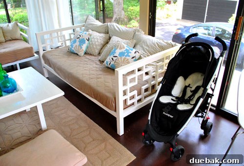 Taming the Baby Clutter 9 The Joovy Kooper stroller, a versatile and essential piece of baby gear, parked outside, ready for family adventures.