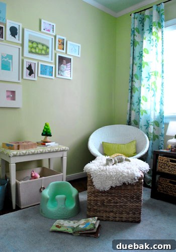 Taming the Baby Clutter 10 Clara, a baby, sitting happily in her Bumbo seat in the nursery, with a partially read book in front of her, illustrating a real-life moment.