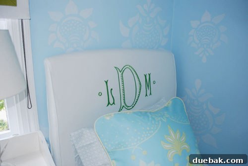 Another view of the redecorated teen room, showcasing the ceiling-height mounted roman shades and elegant blue walls.