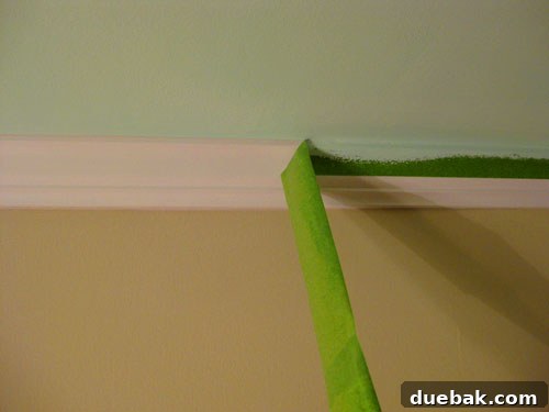 Detail of freshly painted wall with crisp line after tape removal