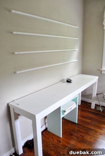 Craft Your Own Stylish Wall Shelves 12 Finished installation of DIY art ledges on the office wall, awaiting decoration