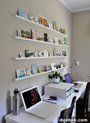 Craft Your Own Stylish Wall Shelves 14 Overall view of the completed postcard art ledges in a stylishly decorated office
