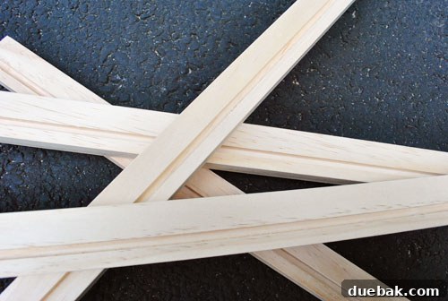 Craft Your Own Stylish Wall Shelves 8 Close-up of a routed groove in a white-painted wood board, ready for art display