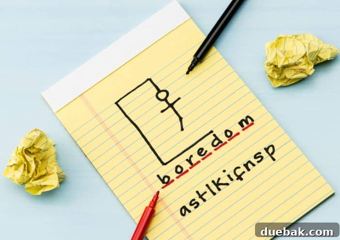 Close-up of a hand drawing a letter 'E' in a Hangman game, filling in part of the word.