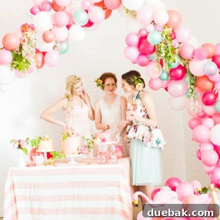 Pink flamingo balloon arch decor for a bridal shower, showcasing color and size variety.