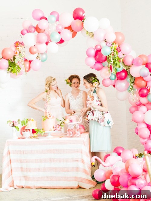 Pink flamingo themed balloon arch for a bridal shower
