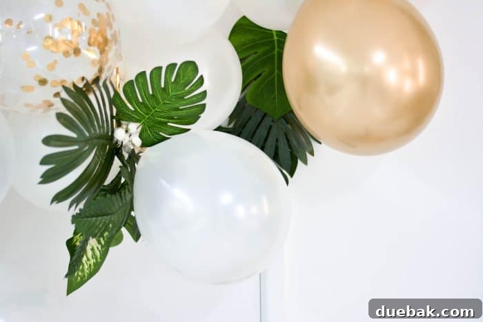 Outdoor balloon garland with greenery