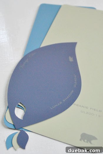 From Chip to Chic Decor 8 Behr paint chips with perforated holes and a ring for creating a custom fan deck