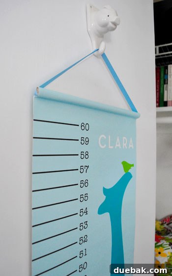 Clever Closet Shelf for Built-In Dog Crate 13 Personalized growth chart hanging on the inside of the closet door with a ceramic pig hook