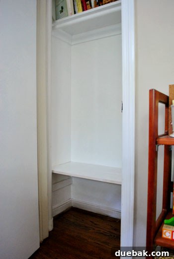 Clever Closet Shelf for Built-In Dog Crate 9 Freshly painted closet interior with the new white shelf, looking clean and organized
