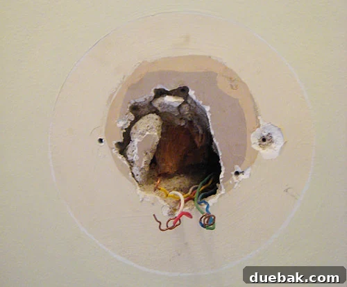 oldthermostatremoved Wall cavity after removing the old thermostat, revealing wires