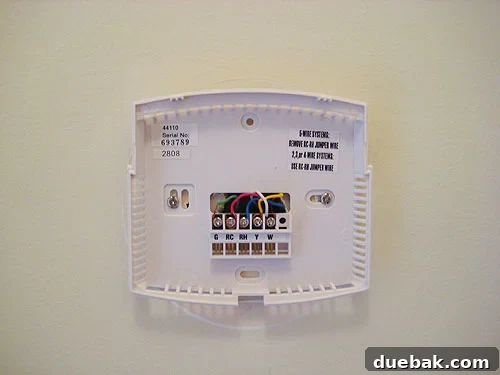 newhunterthermostatinstallation New Hunter programmable thermostat being installed, with wires connected