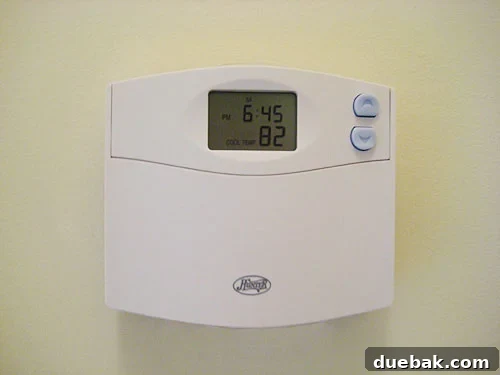 newhunterthermostat Newly installed Hunter programmable thermostat on a wall