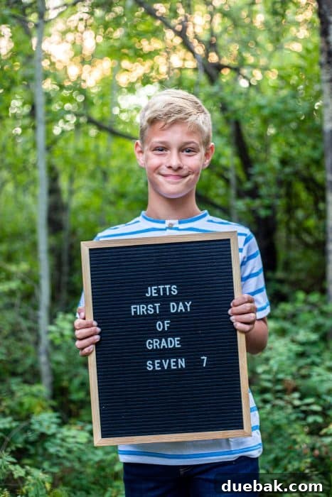 An inspiring visual of a beautifully set up first day of school photo op, including props and a sign.