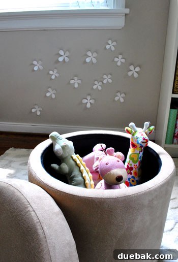 Smart Space: Office & Guest Quarters 13 Close-up of interactive playroom elements: magnetic wallflowers on the wall and a flashcard clothesline above the sofa.