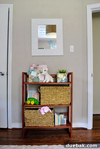 Smart Space: Office & Guest Quarters 14 A bookcase neatly filled with children's toys and books, alongside a functional ottoman, demonstrating effective playroom organization.