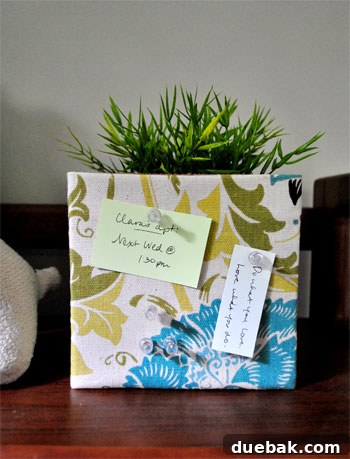 Transform Cork Into Chic Fabric Vases 12 Front view of a beautifully finished fabric-covered DIY cork vase, showcasing the seamless pattern and elegant design.