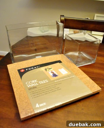 Transform Cork Into Chic Fabric Vases 4 Crafting materials laid out, including cork squares, glass vase, and an Exacto knife, ready for DIY cork vase project.