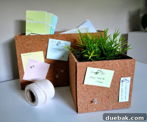 Transform Cork Into Chic Fabric Vases 6 Completed DIY cork vase showcasing its natural texture, filled with green plant and paint swatches, on a wooden surface.