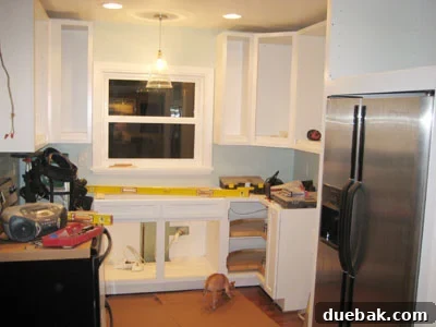 Our Kitchen Cabinets Channel Mariah Carey 3 Another view of the kitchen showing more installed cabinets and the dedicated spot for an integrated microwave.