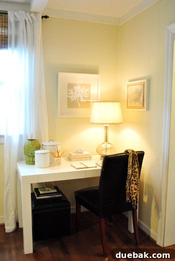Updated den corner desk with a minimalist setup, featuring a new gourd lamp, a green plant, and a serene, inviting atmosphere.