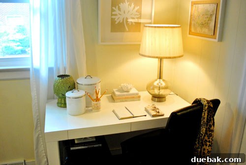 Close-up of the decluttered desk area, highlighting the absence of old office equipment, a clean surface, and a new personal notebook.