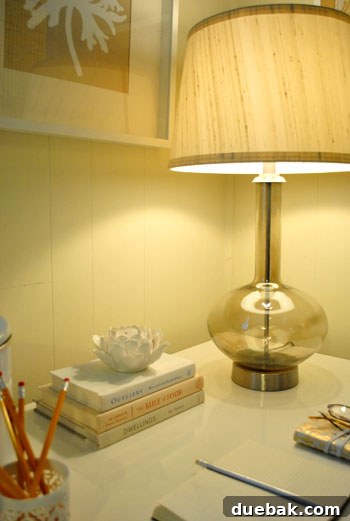 Elegant gourd lamp on the desk, providing soft, ambient lighting in the redecorated den corner, complementing the new aesthetic.
