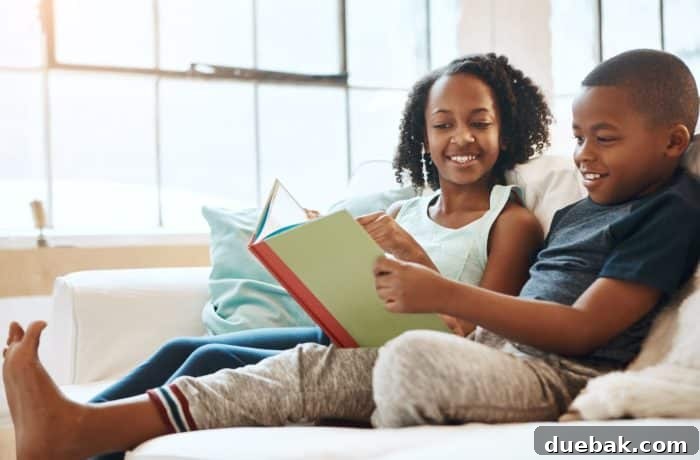 Smart Tips for Saving on Books 2 Two children engrossed in reading books on a comfortable couch, illustrating the joy of reading at home.