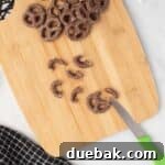Simple Spooky Spider Treats for Halloween 11 Adding pretzel legs to a chocolate-covered Oreo
