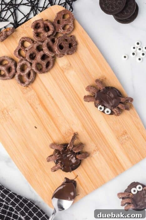 Simple Spooky Spider Treats for Halloween 6 A nearly completed spider treat, with chocolate-covered Oreo and pretzel legs, ready for candy eyes.