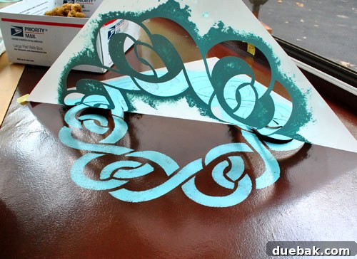 Transform Your Concrete Floor with Paint and Stencils 9 Smiling with a perfectly stenciled pattern on the floor