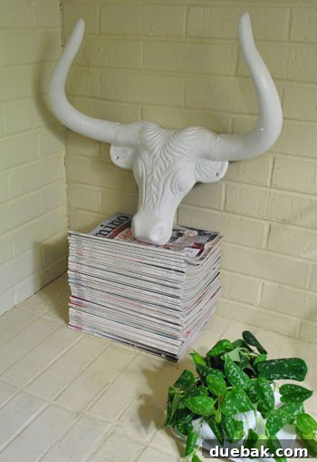 A robust iron bull sculpture with a sleek finish, showcasing a no-nonsense and powerful aesthetic in home decor.
