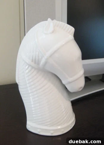 A serious and angular horse bust sculpture with refined features, exuding a noble and powerful presence in decor.
