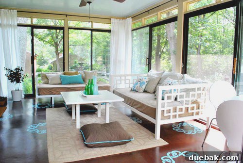 Sunroom showcasing stencils peeking under a daybed and area rug