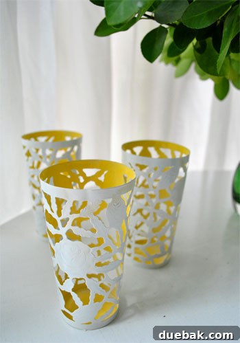 A beautifully transformed two-tone metal cup, with a vibrant yellow interior and a crisp white exterior, ready for display.