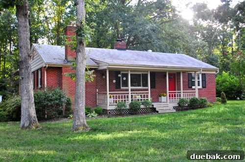 Old roof before replacement, showing flat, worn shingles
