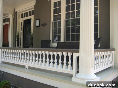 Wider perspective of the beautifully restored historic Fan District home, showcasing its enhanced curb appeal and architectural harmony.