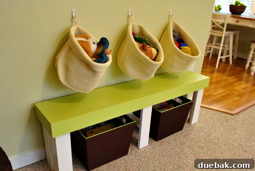 Farah's Living Room Makeover: The Finished Look 11 Hanging Ikea baskets above green bench for toy storage