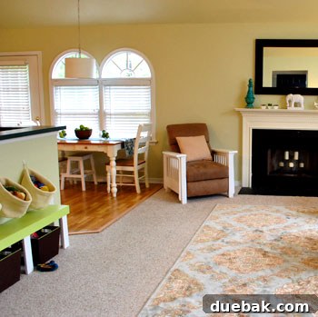 Farah's Living Room Makeover: The Finished Look 10 Kid's zone with green bench, painted recliner, and wall storage