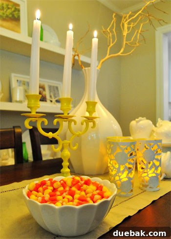 Overview of the dining table Halloween decorations featuring a bold lemon yellow theme.