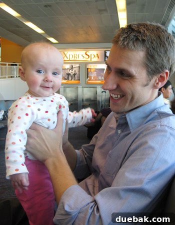Baby Clara smiling at the airport gate