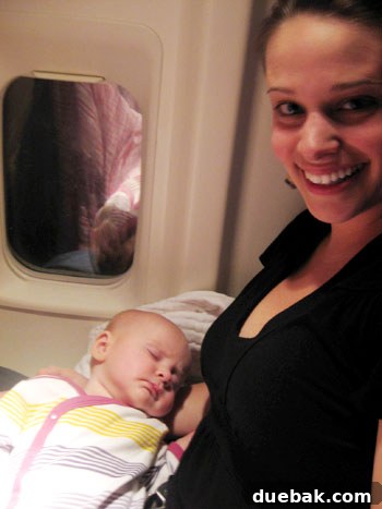 Baby Clara sleeping peacefully on her first flight
