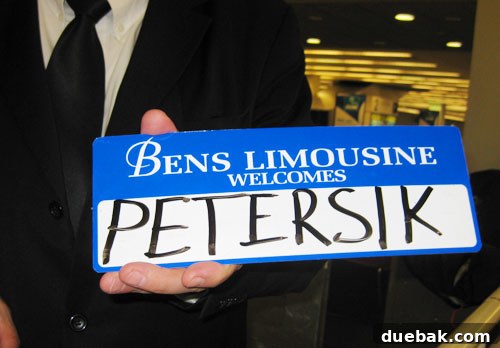 Limo service sign with names at LaGuardia Airport