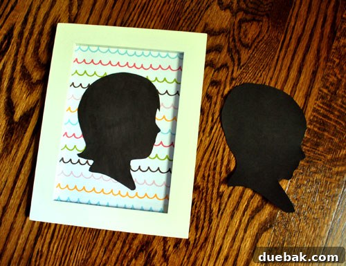 Framed baby silhouette replacing the placeholder in the nursery