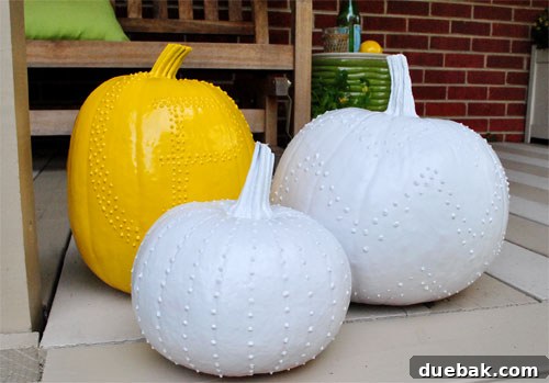 Create Whimsical Puffy Paint Pumpkins 12 Pumpkins after being spray painted in yellow and white