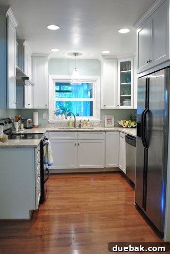 Kitchen after rug removal, showcasing hardwood floors