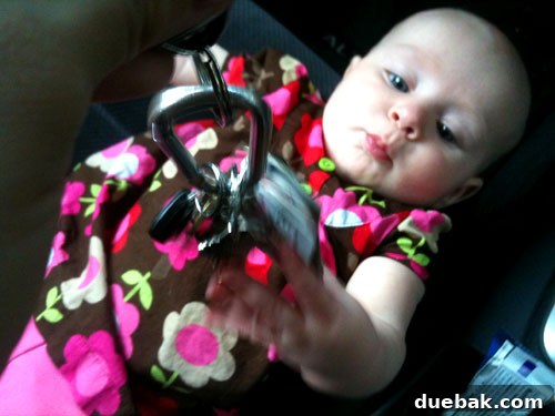 Mastering House Showings For Sale By Owner 5 A baby engrossed in playing with car keys, demonstrating resourcefulness